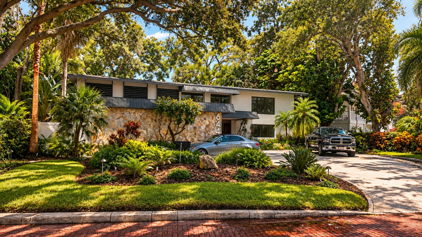Midcentury home with a low roofline and stone accent wall in Lake Pasadena